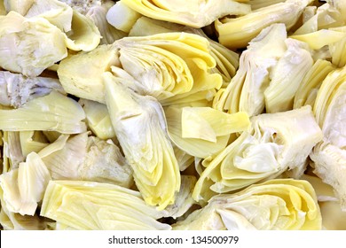 A close view of the quartered unopened bloom of the artichoke.