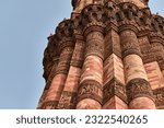 Close up view of Qutb Minar minaret tower part Qutb complex in South Delhi, India, copy space, big red sandstone minaret tower landmark popular touristic spot in New Delhi, indian architecture