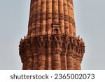 Close up view of Qutb Minar minaret tower part Qutb complex in South Delhi, India, big red sandstone minaret tower landmark popular touristic spot in New Delhi, indian architecture building