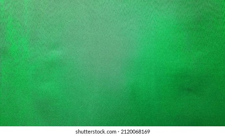 Close Up View Of Real Green Screen Background In Film Studio. Green Velvet Fabric Background. Real Green Ccreen For Stock Footage Video.