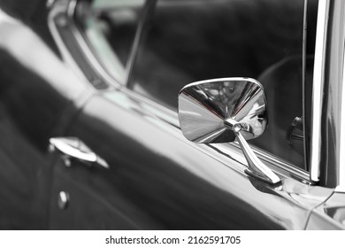 Close Up View Of Rear View Mirror Of Classic Car.