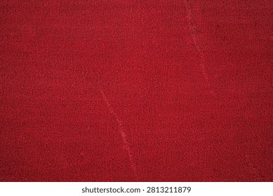Close view of a red textured surface with subtle sheen.