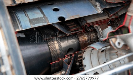 Close view reveals complex inner workings of a jet engine's components and design.