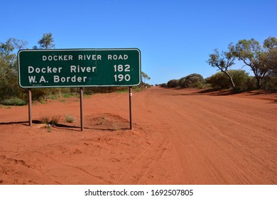 Close Up View Of Road Sign In Northern Territory, Australia At The Beginning Of Long Red Dust Road To Western Australia