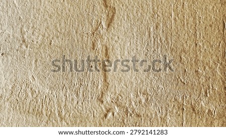 Close up view of a rough textured surface featuring natural organic patterns and vertical striations in shades of light brown and beige creating an abstract background