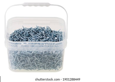 Close up view of screws for gypsum wallboard in plastic box isolated on white background. Industrial equipment concept.