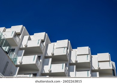 Close up view of several abstract sections of building balconies.