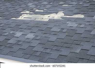 A close up view of shingles a roof damage