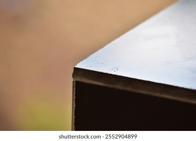 close up view of side and surface of black granite stone. Selective focus and blurred background