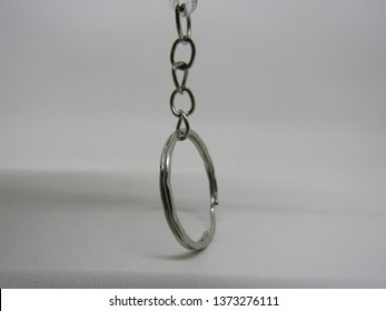 Close up view of silver key chain hook or kaitan gantungan kunci. Isolated on white background