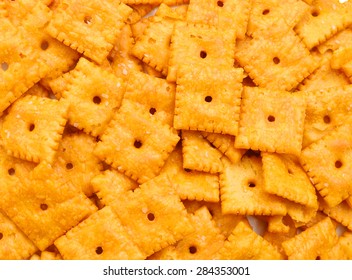 A Close View Of Small Square Cheese Crackers.