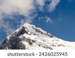 Close Up View of Snow Capped Mountains Peaking Through the Clouds in Switzerland