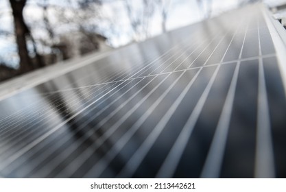 Close up view of a solar panel in the middle of the city, used to create green energy