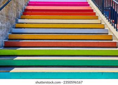 Close up view of solid colors on edge of pastel colored stairs