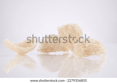 Close up view of some edible bird’s nest on white background. Advertising photo for products from natural bird’s nest - healthcare food.