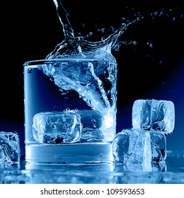 Close up view of the splash in water on black - Powered by Shutterstock