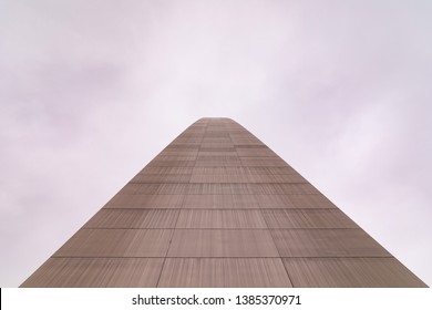 Up Close View At St Louis Gateway Arch. A Side Of The Arch Creates A Path Into The Cloudy Winter Sky