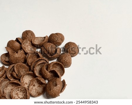 Close up view of a stack of chocolate cereal isolated on a white background, Koko Krunch cereal for kids