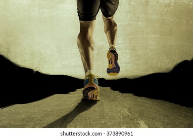 close up view strong athletic legs with ripped calf muscle of young sport man running on grunge asphalt road in sport fitness endurance and high performance concept