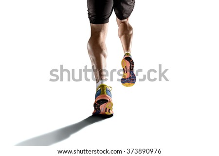 close up view strong athletic legs with ripped calf muscle of young sport man running isolated on white background with copy space in sport fitness endurance and high performance concept Stock photo © 