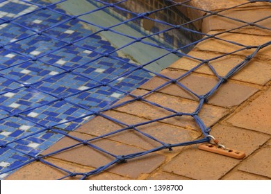 Close Up View Of A Swimming Pool Net, Used To Prevent Accidental Drowning.