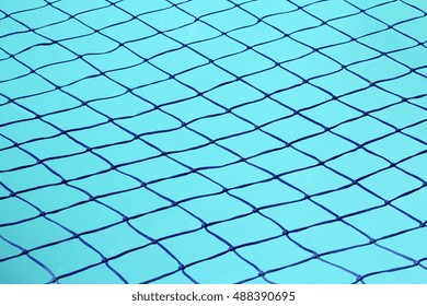 Close Up View Of A Swimming Pool Net, Used To Prevent Accidental Drowning.