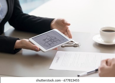 Close Up View Of Tablet In Female Hands With Architectural Plan Of Two Story House Section Cut Drawing Draft And Contract On The Table. Home Loan, Taking Mortgage To Buy Own Cottage Or Villa