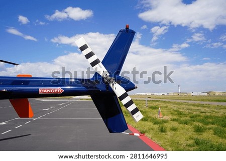 A Close Up View of the Tail Boom and Rotor on a Helicopter
