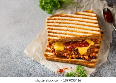 Close Up View Of Tasty Sloppy Joe Sandwich With Ground Meat, Sauce And Cheese On Light Background