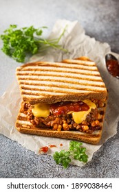 Close Up View Of Tasty Sloppy Joe Sandwich With Ground Meat, Sauce And Cheese On Light Background