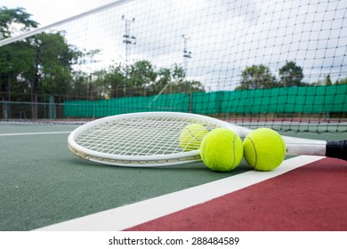 Close up view of tennis racket and balls on the tennis court - Powered by Shutterstock