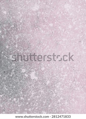 Close up view of a textured pinkish surface with irregular white spots and scattered debris with creating weathered texture displays close rough background corrosion