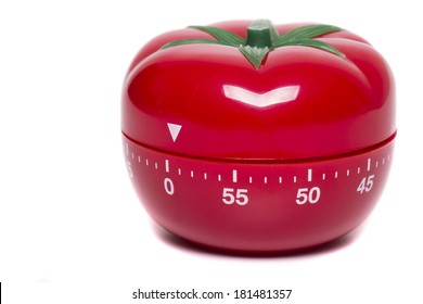 Close Up View Of A Tomato Kitchen Clock Timer Isolated On A White Background.