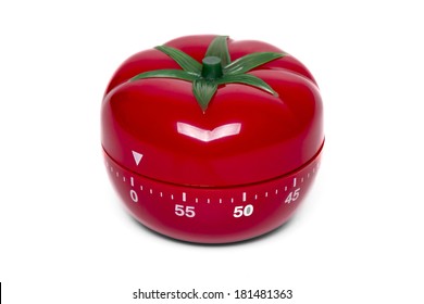 Close Up View Of A Tomato Kitchen Clock Timer Isolated On A White Background.