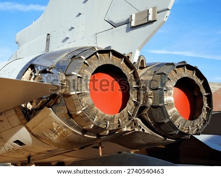 A Close Up View of Twin Jet Engine Exhausts on a Fighter Jet