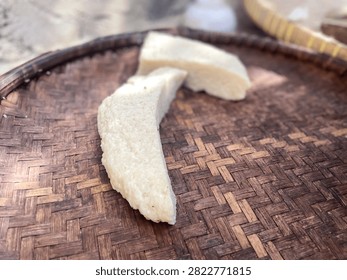 Close up view of two slices of fresh legendar traditional food placed on a rustic traditional woven bamboo tray.