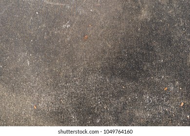 Close View Of A Very Dirty Black Mouse Pad.