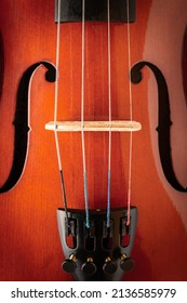 Close View Of A Violin Strings And Bridge