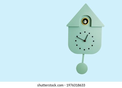 Close Up View Of Wall Cuckoo Clock On Blue Background. Sweden.