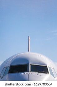 Close view of a white big jet plane cockpit. Space for text.