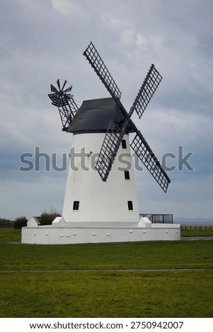a close up view of the windmill located at Lytham in Lancashire. The sky is overcast and there is space for copy text in the picture