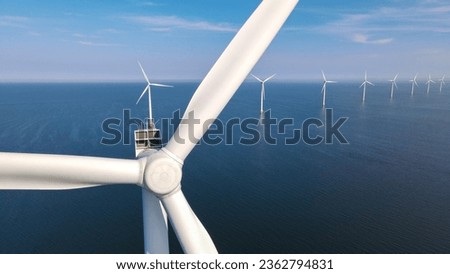 close up view at Windmill park with a blue sky, Windmill Park in the ocean aerial view with wind turbine Flevoland Netherlands Ijsselmeer. Green Energy Production in the Netherlands Stock photo © 