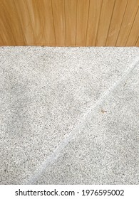 Close Up View Of Wood Plastic Composite Wall And Gravel Finish Floor