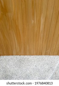 Close Up View Of Wood Plastic Composite Wall And Gravel Finish Floor