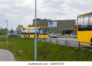 Close up view of yellow city busses on Uppsala landscape view background. Sweden. Uppsala. 06.19.2022.