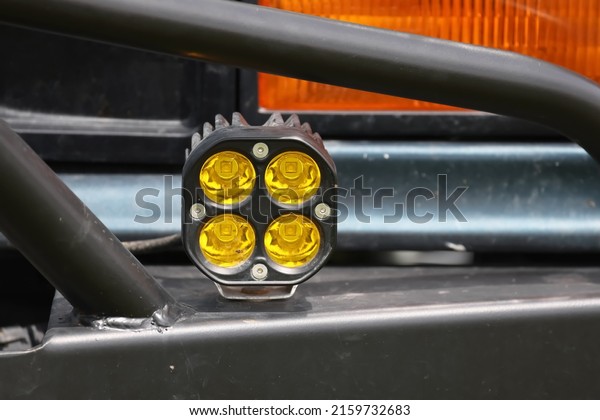 Close up view of yellow LED fog lamp installed on\
the truck bumper