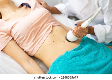 Close Up View Of Young Woman Belly During Electroporation Mesotherapy Body Treatment At Aesthetic Clinic