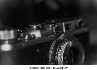 Close Up Of Vintage Camera. Old Retro Technology. Black And White Photo. Grunge Effect.