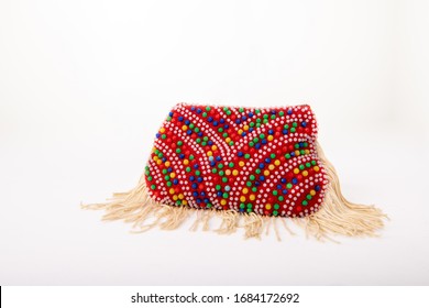 Close Up Of A Vintage Coin Purse, Made From Beads. It Has Tassles And A Retro Style From The 1970s.