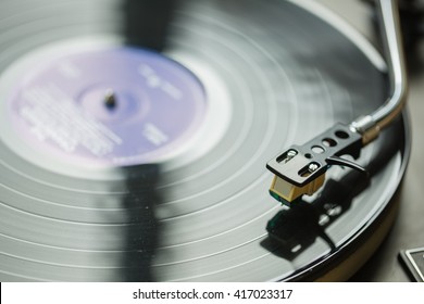 close up of vintage record player with vinyl disc - Shutterstock ID 417023317